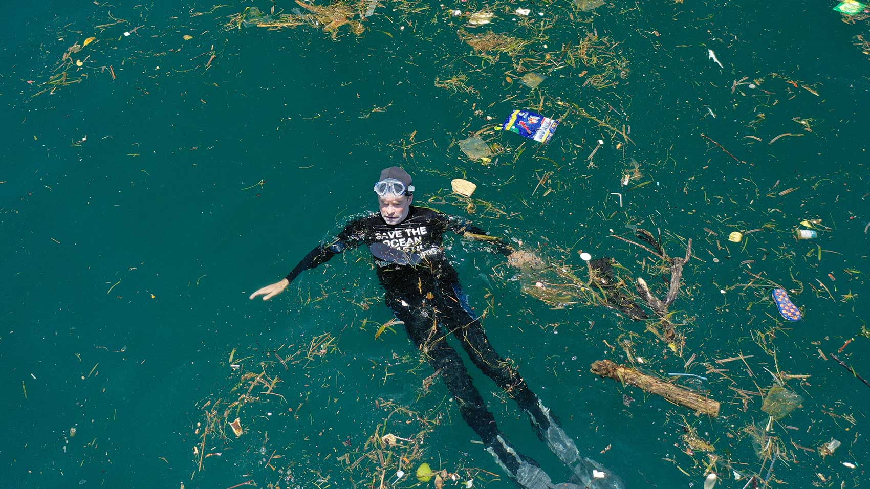 swimming in plastic ocean pollution