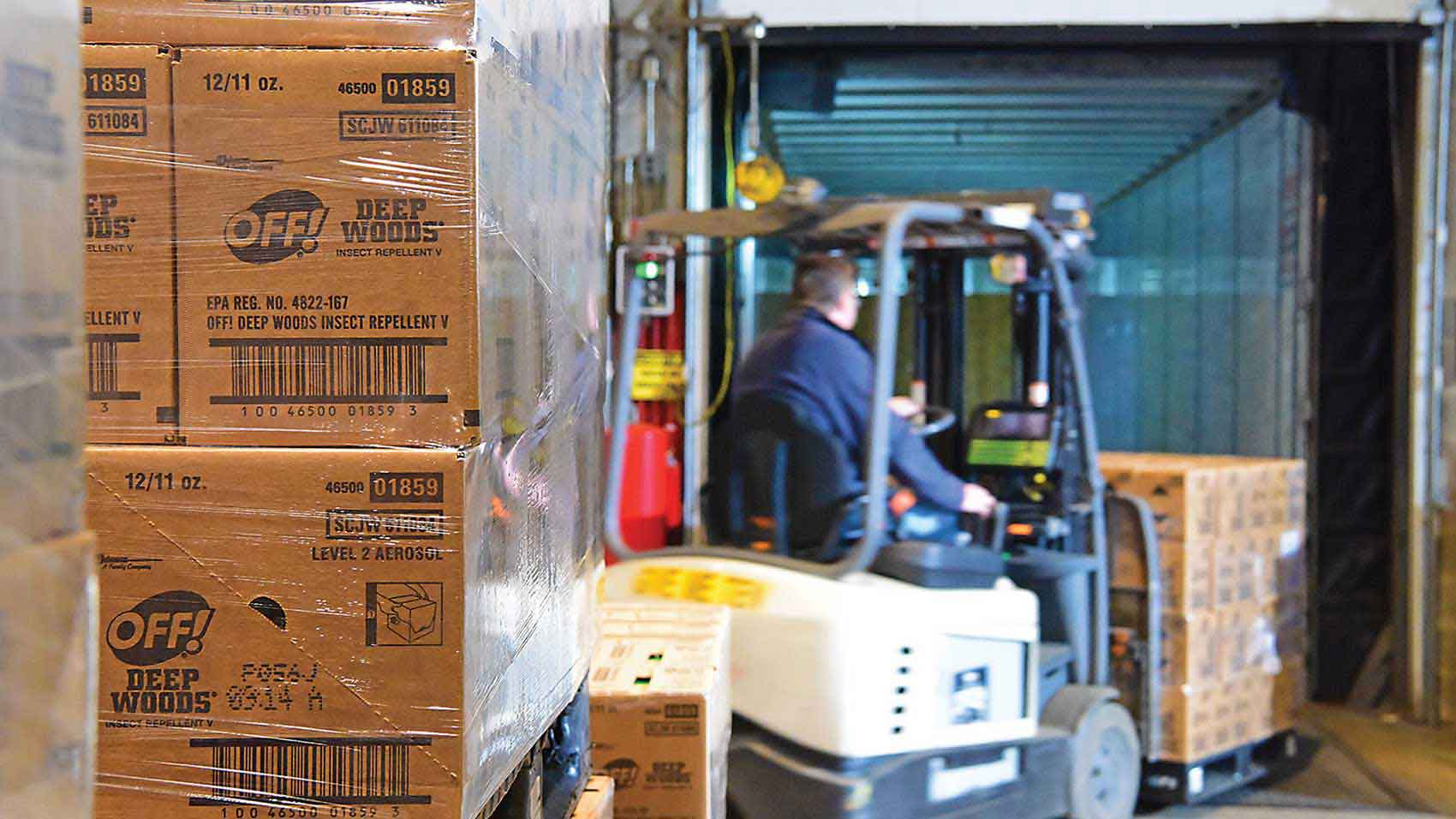 An employee moving pallets of donated products at SC Johnson