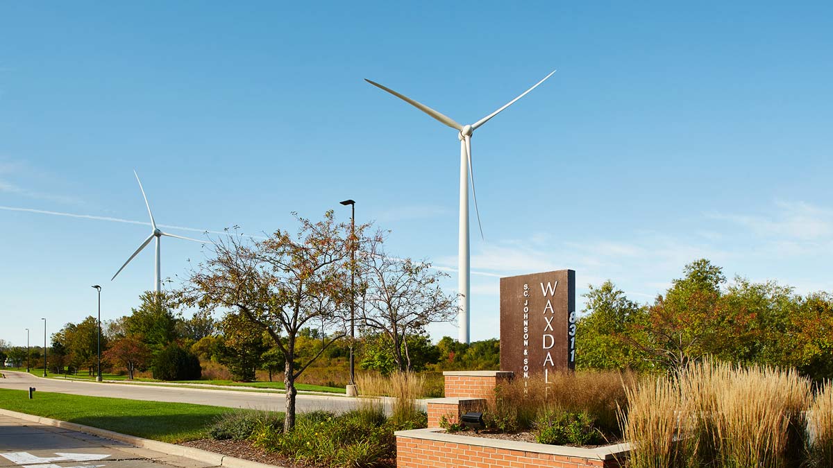 Entrance to SC Johnson Waxdale manufacturing facility with its wind turbines in the background