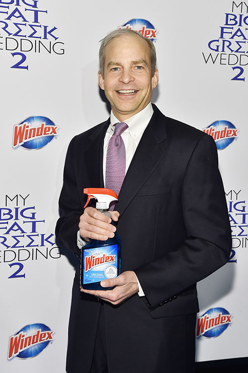 Fisk Johnson, Chairman and CEO of SC Johnson, poses with Windex® Original  Glass Cleaner at the premiere of My Big Fat Greek Wedding 2