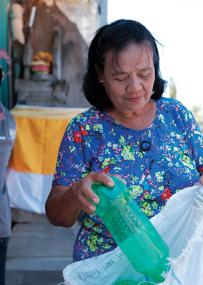 women recycling plastic bottle