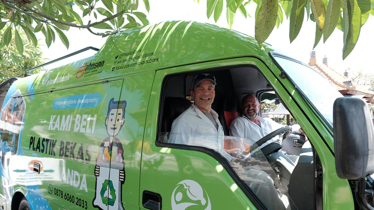 Fisk Johnson Chairman and CEO of SC Johnson and David Katz CEO of Plastic Bank unveil a mobile collection center in Indonesia