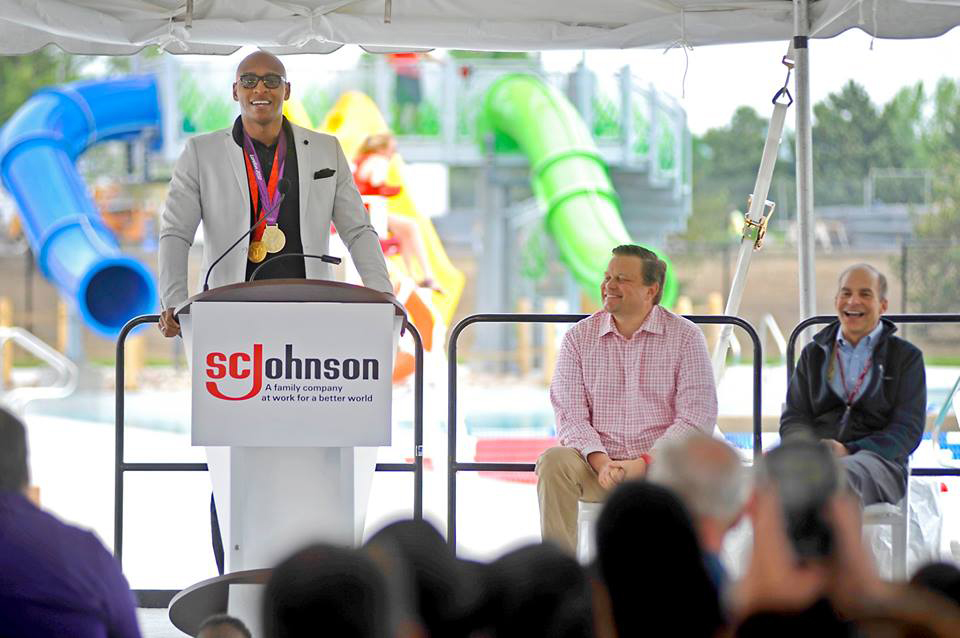 Olympic medalist Cullen Jones speaks at the opening of the SC Johnson Community Aquatic Center