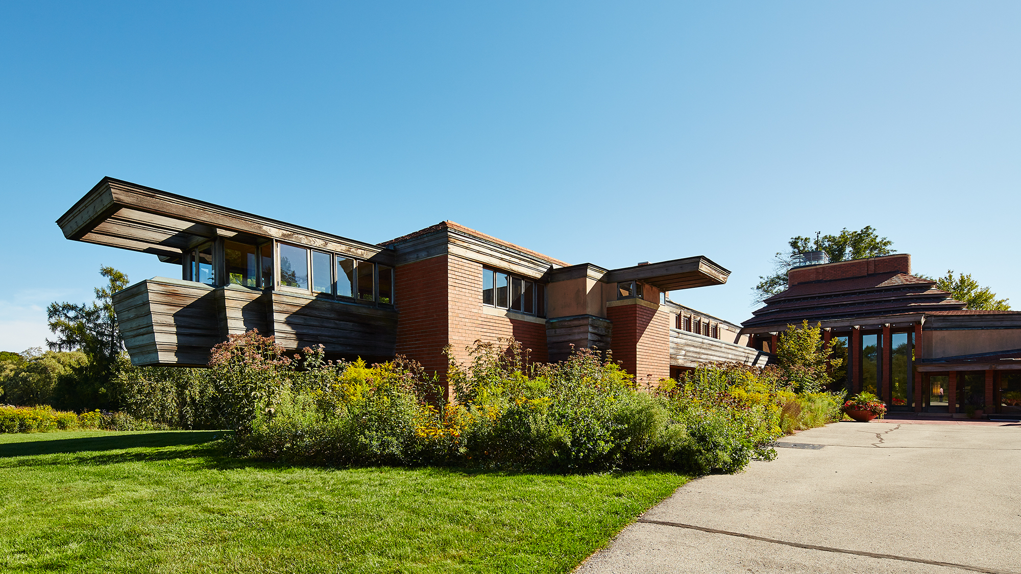 Horizontal lines and unstained wood architecture features by Frank Lloyd Wright