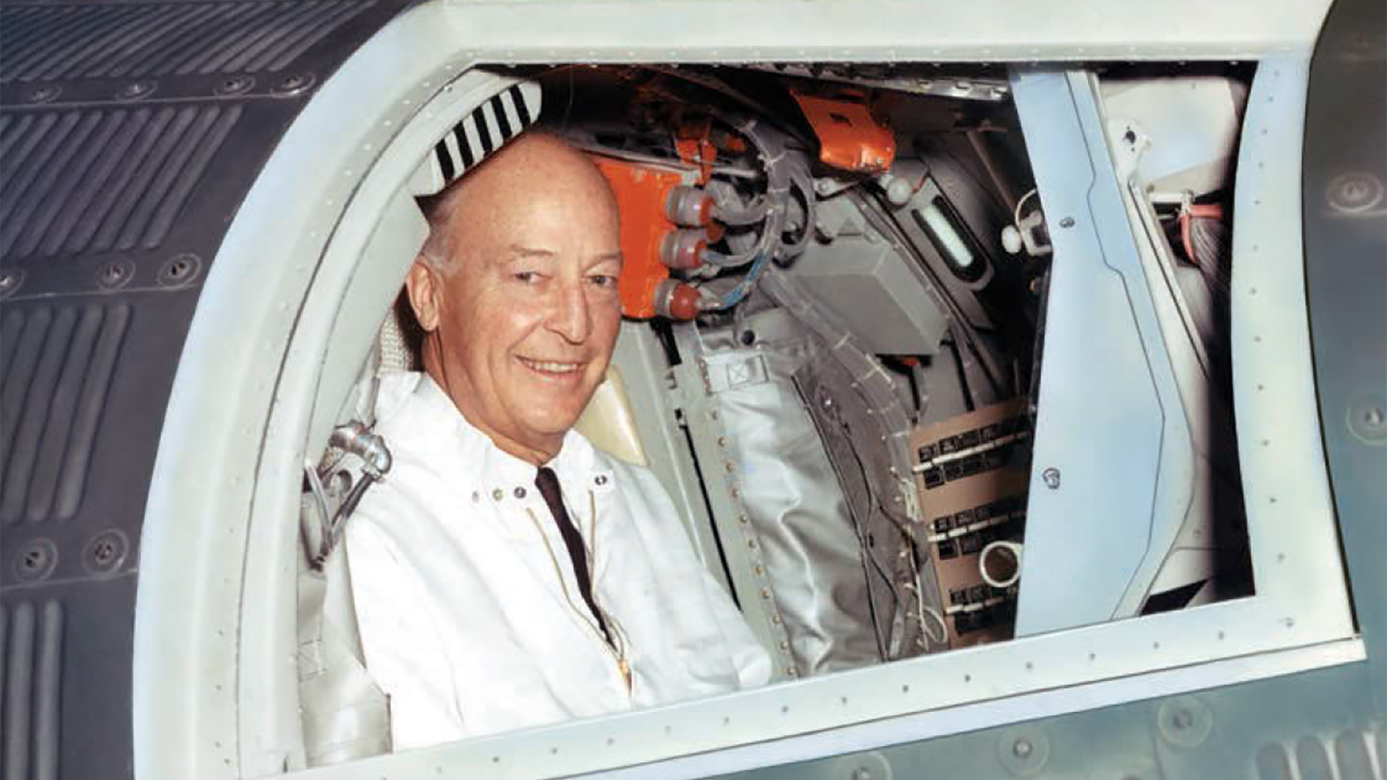 Herbert F Johnson, Jr. in a Mercury space capsule at McDonnell Aircraft