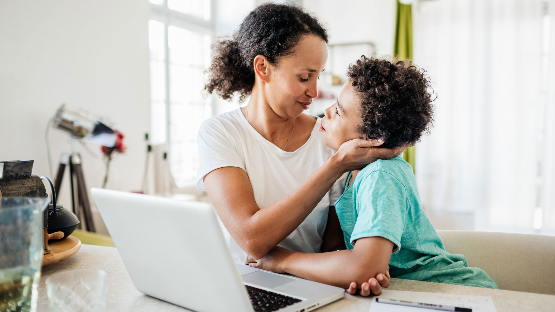 Mother taking a break from working to talk to her son.