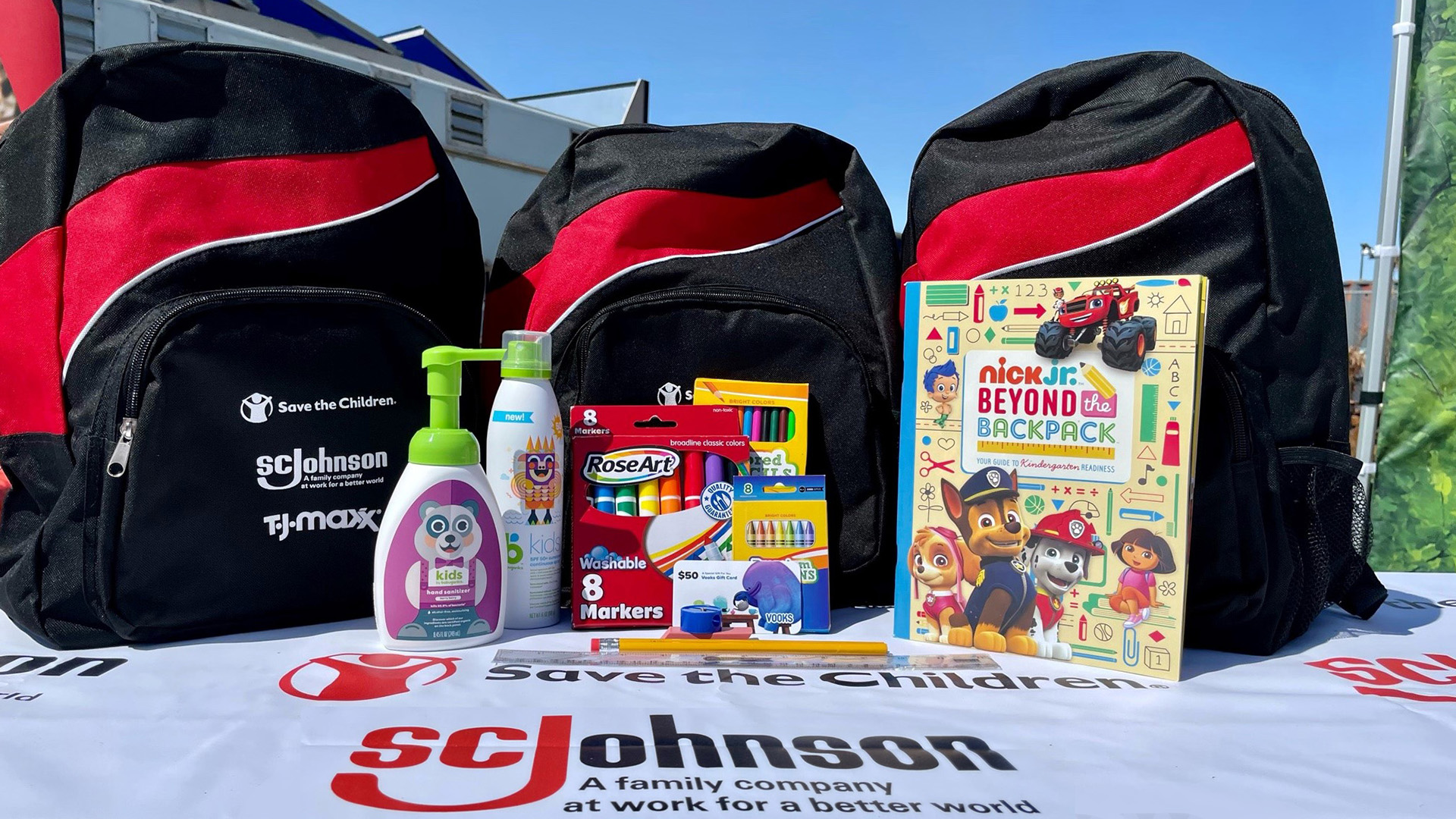 SC Johnson sponsored backpack and material on table